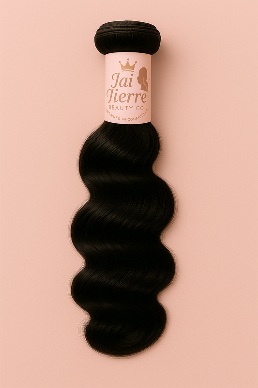 Black hair extensions with a visible brand label on a pink background